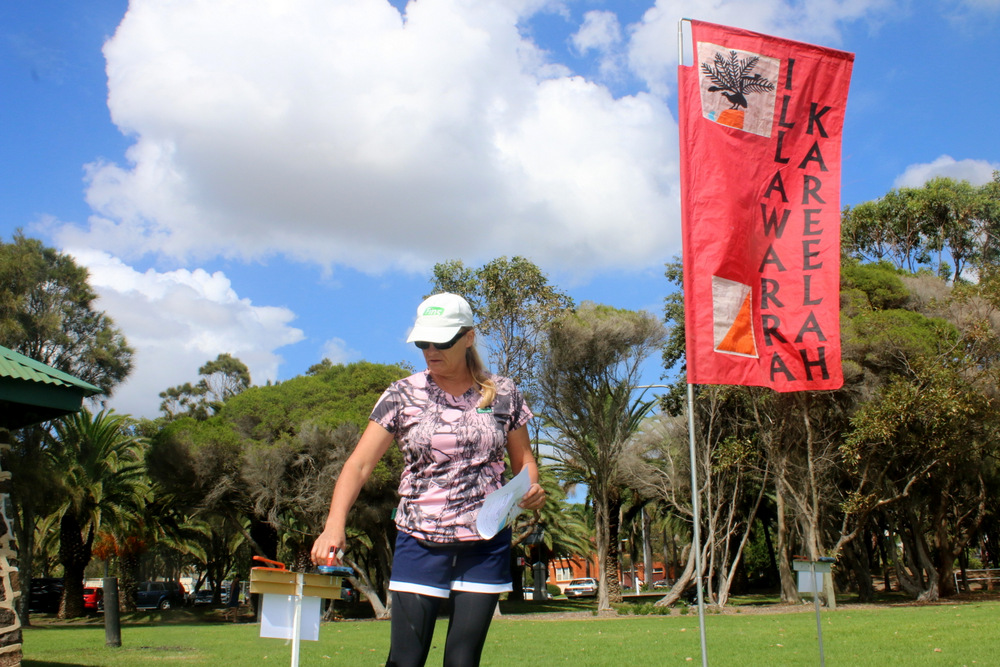 Salme Fuller punches the start control at SummerGong 1 in Stuart Park